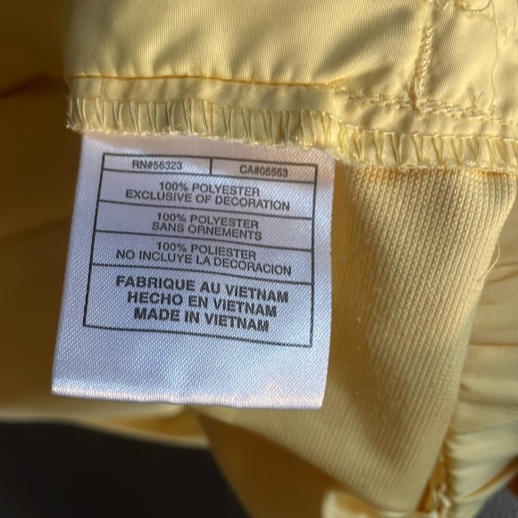 Nike Golf pullover. Yellow w/slate blue trim. It has front pockets that zip. - Picture 6 of 7